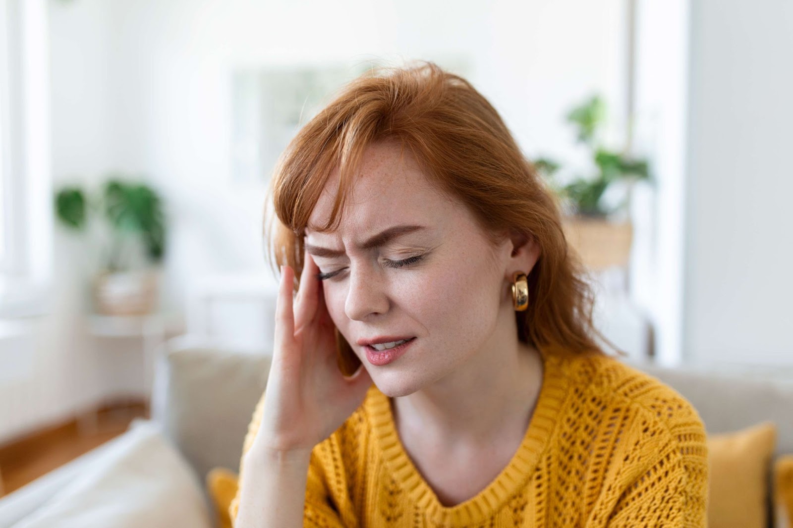 A woman suffers from headaches