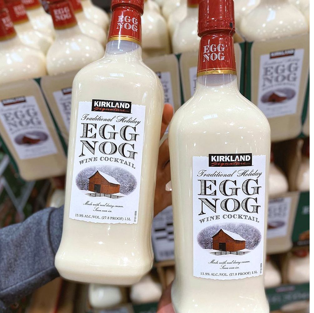 Hand holding two bottles of Egg Nog