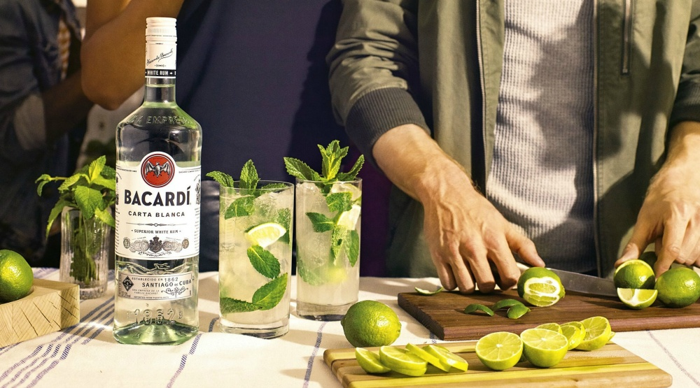 Man slicing a lime for a cocktail