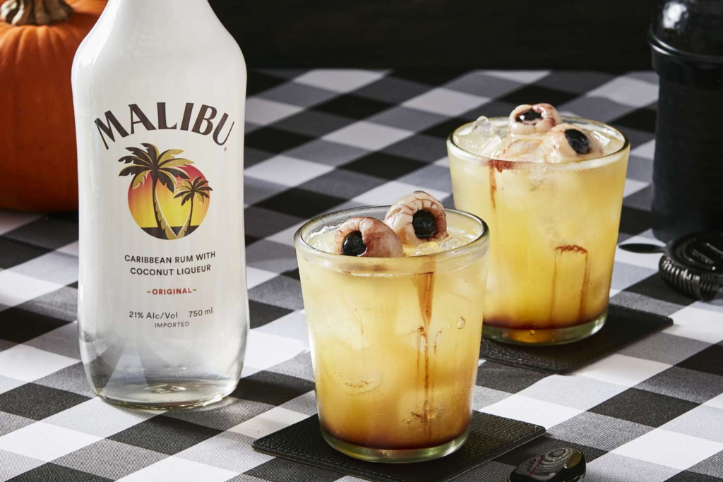 Bottle of Malibu with two cocktails