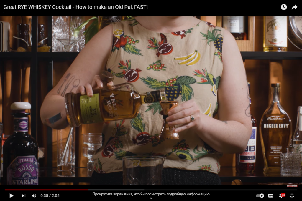 Girl prepares whiskey cocktail