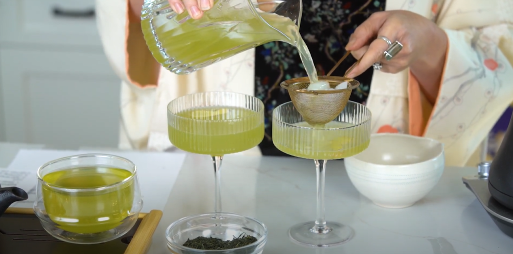 Glasses of cocktails with ice and cocktail being poured