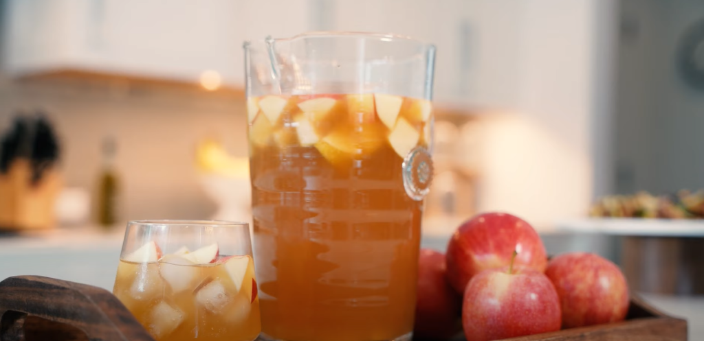 Glass of drink with apple slices